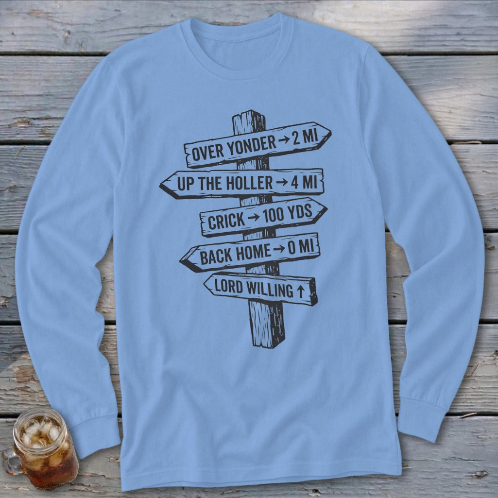 Light blue long-sleeve t-shirt with a black graphic of a rustic wooden signpost pointing in various directions with humorous text.