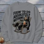 Gray crewneck sweatshirt featuring a graphic of a black bear relaxing in a rocking chair.