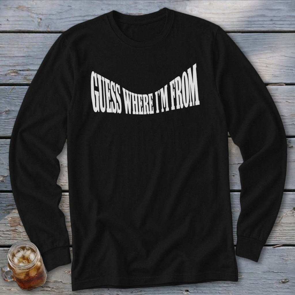 Black long-sleeve shirt with white text "GUESS WHERE I'M FROM".