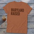 Orange t-shirt with "Maryland Raised" text and a glass of iced tea.