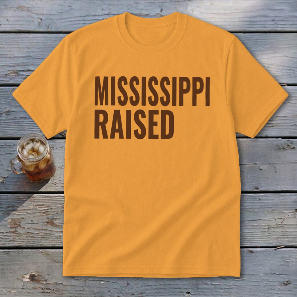 Orange t-shirt with "MISSISSIPPI RAISED" text in dark brown.