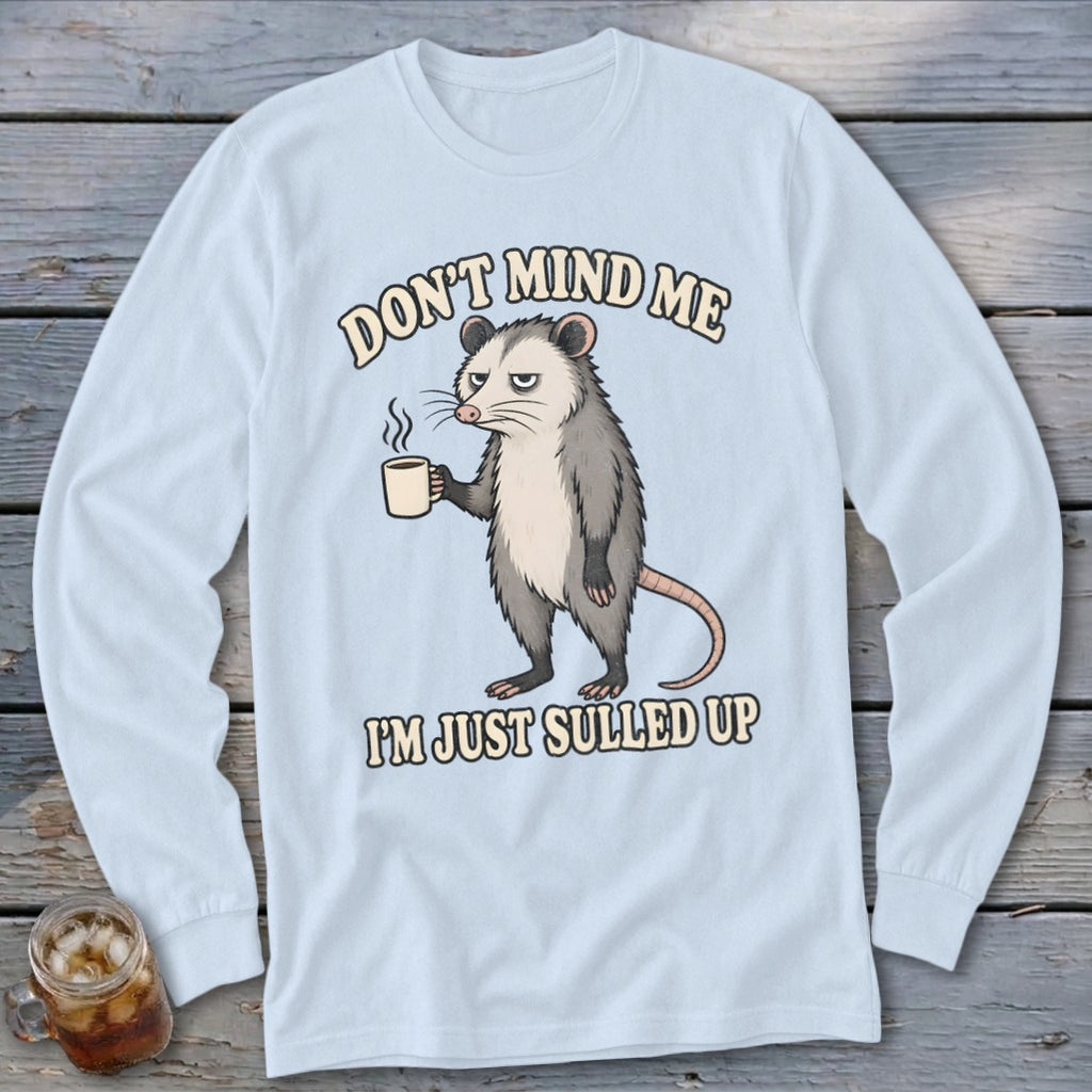 Light blue long sleeve shirt with opossum holding coffee and text "DON'T MIND ME I'M JUST SULLED UP".