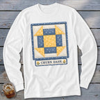 White long-sleeve shirt with "Churn Dash" quilt block design.