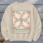 Light beige sweatshirt with a "Double Wedding Ring" quilt pattern and text.