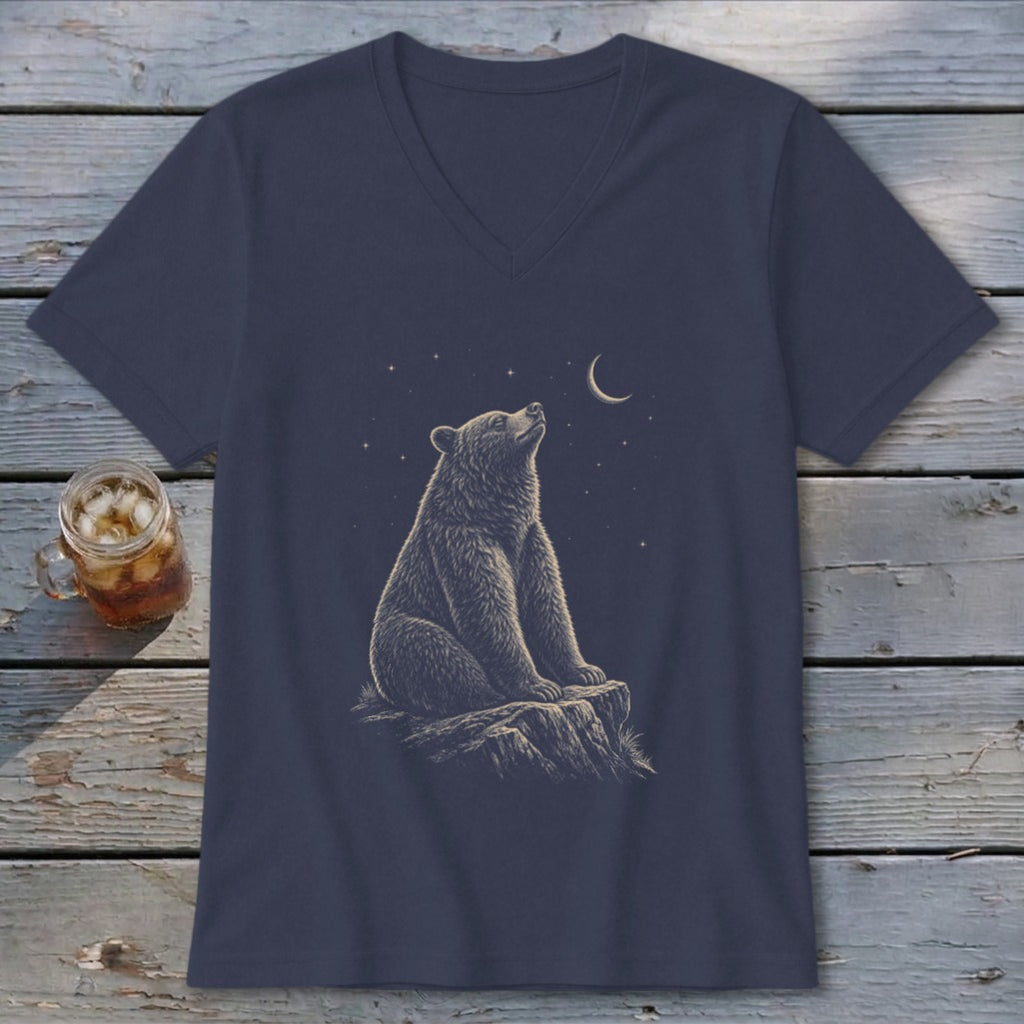 T-shirt with a graphic of a bear sitting on a rock looking at the night sky.