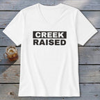 White V-neck t-shirt with black "CREEK RAISED" text in a rectangular box.