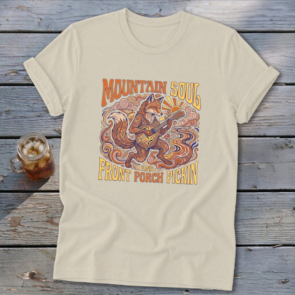 Tan t-shirt with a fox playing guitar and "Mountain Soul and Front Porch Pickin'" text.