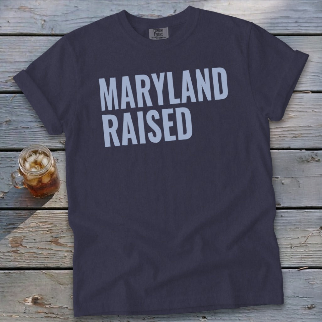 Dark grey t-shirt with "MARYLAND RAISED" in white lettering.