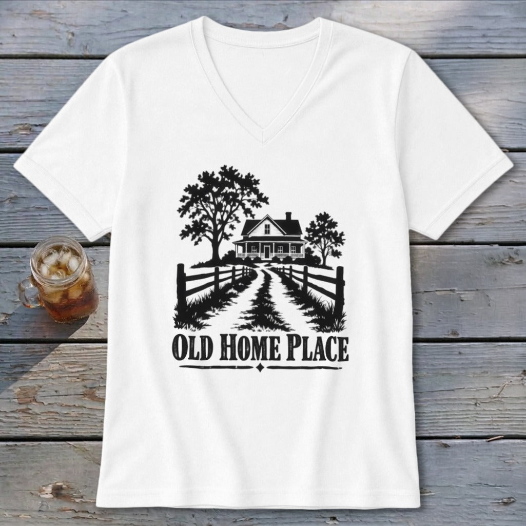 White v-neck t-shirt with a black graphic of a house, trees, fence, and the text "OLD HOME PLACE".