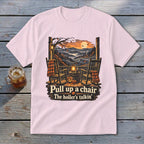 Light pink t-shirt with rustic porch scene graphic and text.