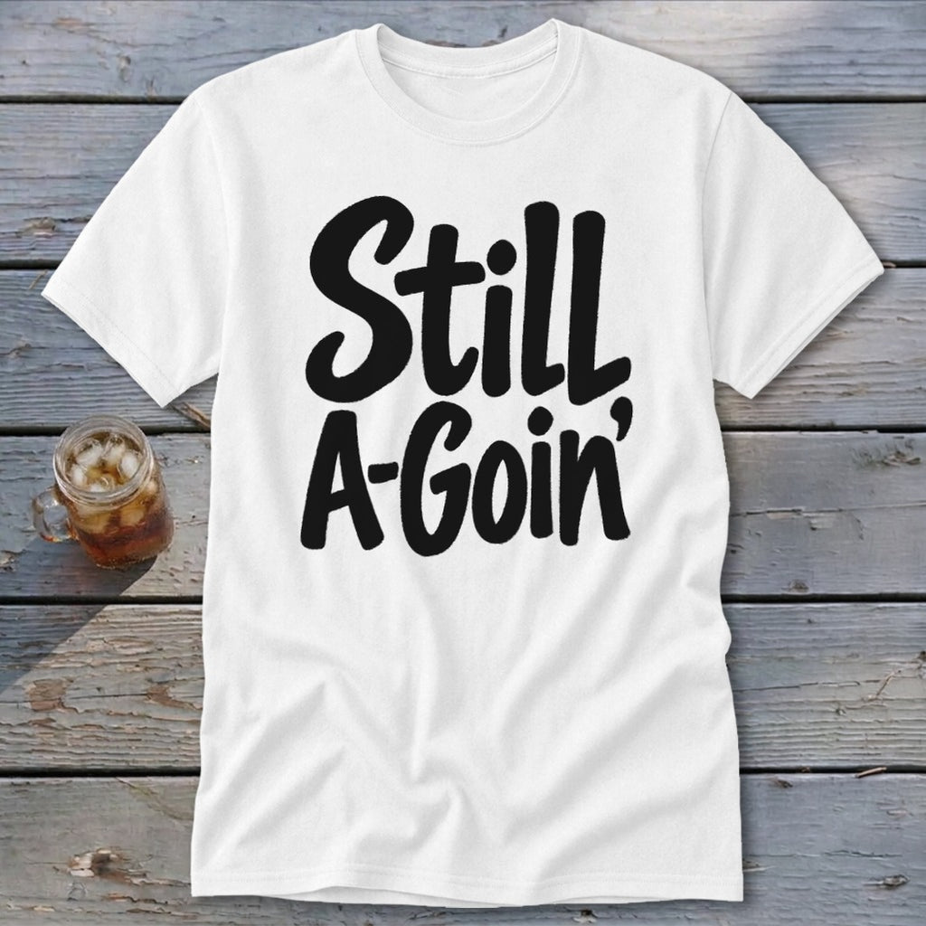A white short-sleeved t-shirt with the black text Still A-Goin' printed across the front.
