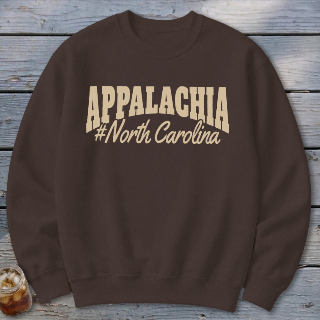 Brown sweatshirt with "APPALACHIA #North Carolina" graphic.