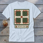 Light blue t-shirt featuring a "Bear's Paw" quilt block design with floral accents.