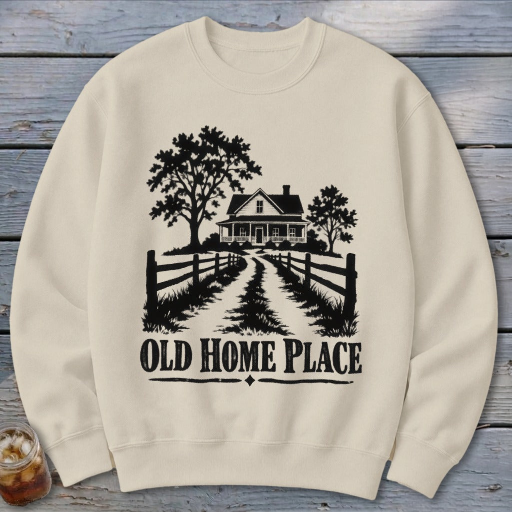 Crewneck sweatshirt with black graphic of a farmhouse, trees, fence, and text "OLD HOME PLACE".