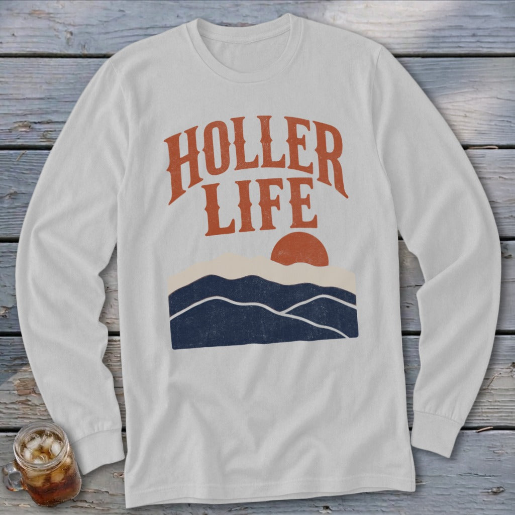 Light gray long-sleeve t-shirt with orange text reading "HOLLER LIFE" over a mountain landscape graphic.
