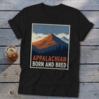 A black t-shirt featuring a retro mountain graphic with the text "Appalachian Born and Bred."