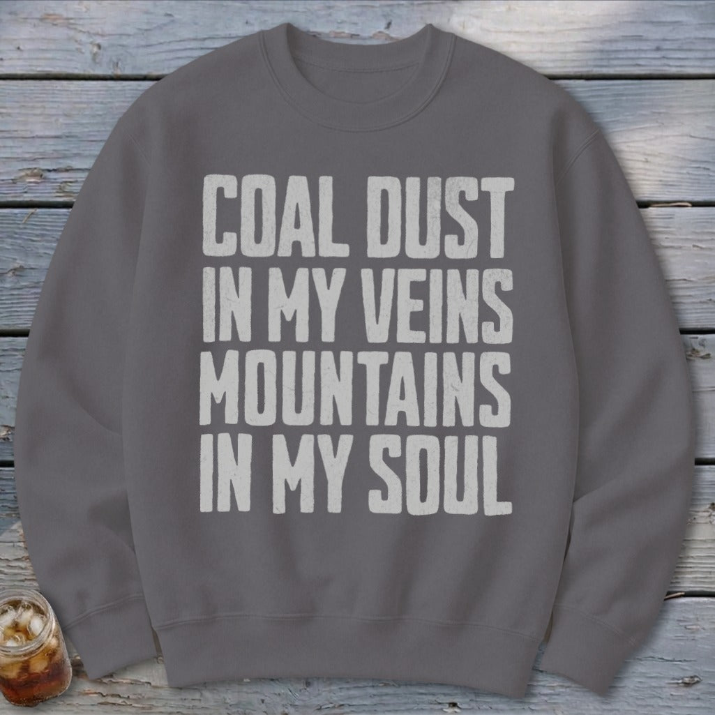 Dark gray crewneck sweatshirt with distressed white text reading COAL DUST IN MY VEINS MOUNTAINS IN MY SOUL.