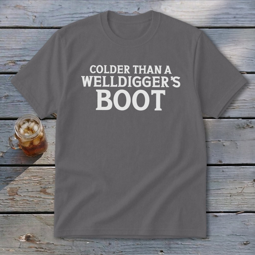 Gray t-shirt with white text reading "Colder Than A Welldigger's Boot."