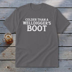 Gray t-shirt with white text reading "Colder Than A Welldigger's Boot."