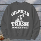 Gray sweatshirt with white text and oil pump graphic: OILFIELD TRASH AND PROUD OF IT.
