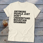 Cream t-shirt with black text reading "Anymore people just don't understand mountain grammar".