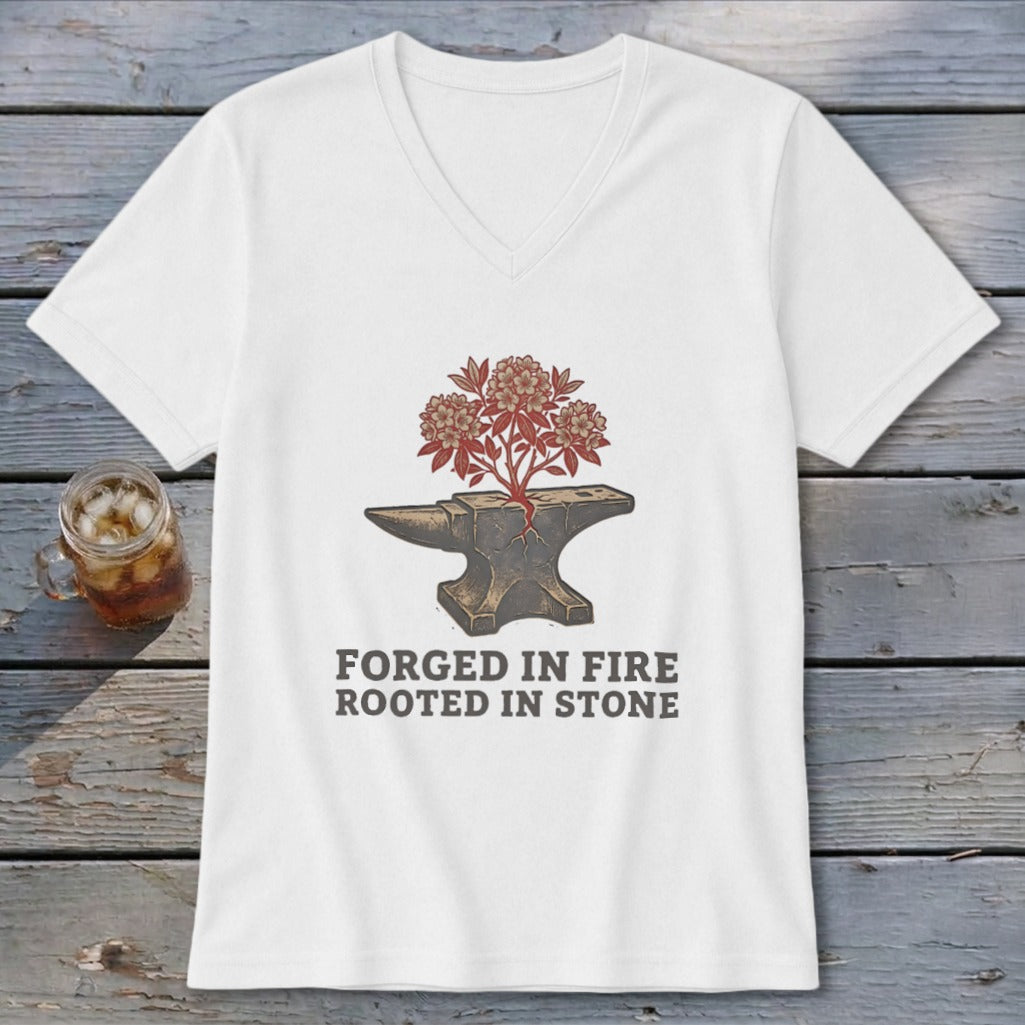 White t-shirt with graphic of an anvil with a plant growing from it and text "FORGED IN FIRE ROOTED IN STONE".