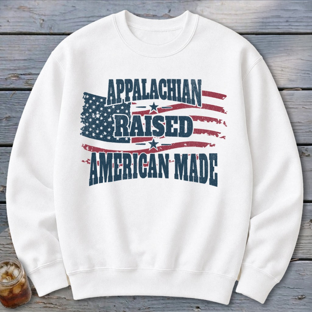 White sweatshirt with distressed American flag and "Appalachian Raised American Made" text.
