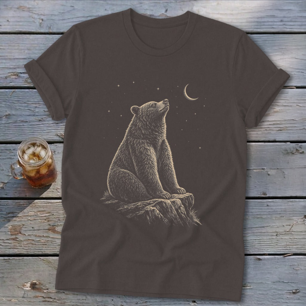 Brown t-shirt featuring a bear sitting on a rock under a starry night sky.