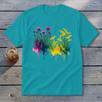 Teal t-shirt with watercolor floral design of pink thistles and yellow wildflowers.