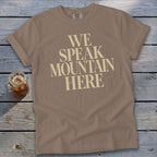 Brown t-shirt with "WE SPEAK MOUNTAIN HERE" text and a glass of iced tea.