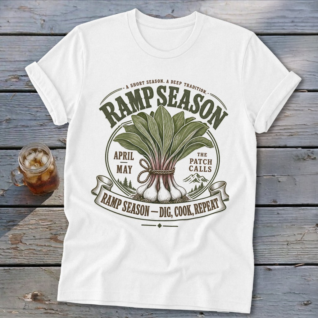White t-shirt with "Ramp Season" graphic featuring ramps, text, and mountains.