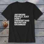Black t-shirt with white text reading "ANYMORE PEOPLE JUST DON'T UNDERSTAND MOUNTAIN GRAMMAR".