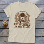 Cream t-shirt with brown lantern emblem and "Established In The Hills" text.