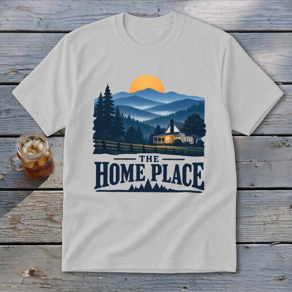 White t-shirt with graphic of a house, mountains, and text "THE HOME PLACE".