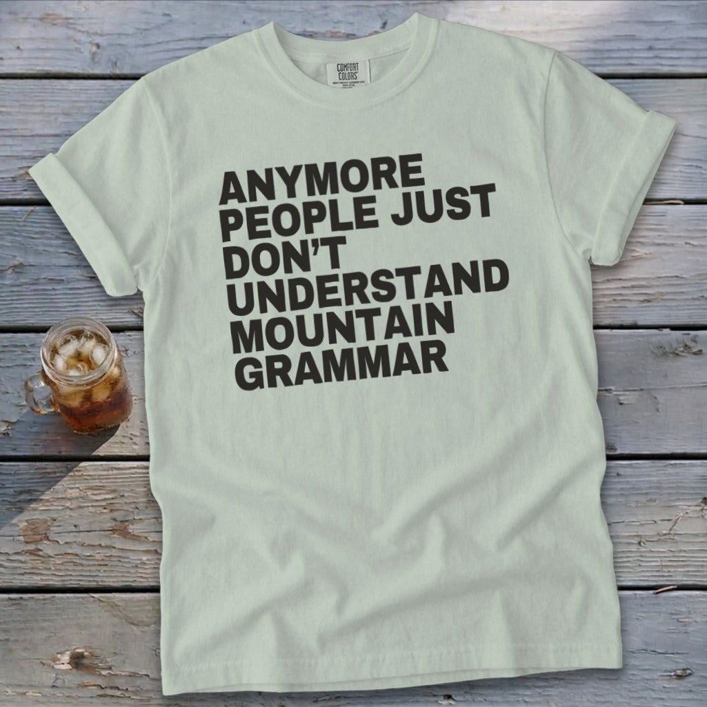 Light green t-shirt with black text reading "Anymore people just don't understand mountain grammar".