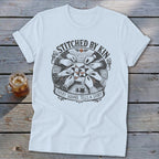 T-shirt with "Stitched by Kin. Every Square Tells a Story" graphic.