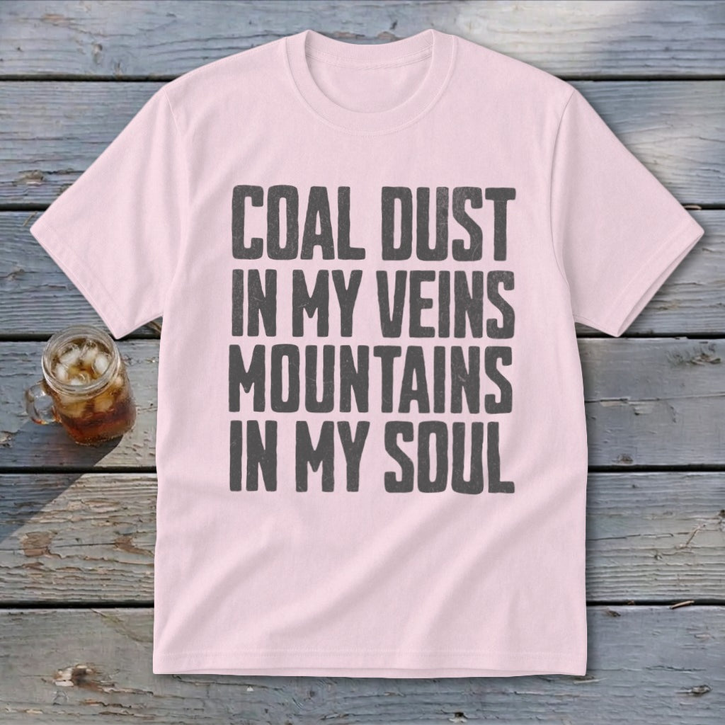 A light pink t-shirt printed with the text Coal Dust in My Veins Mountains in My Soul.