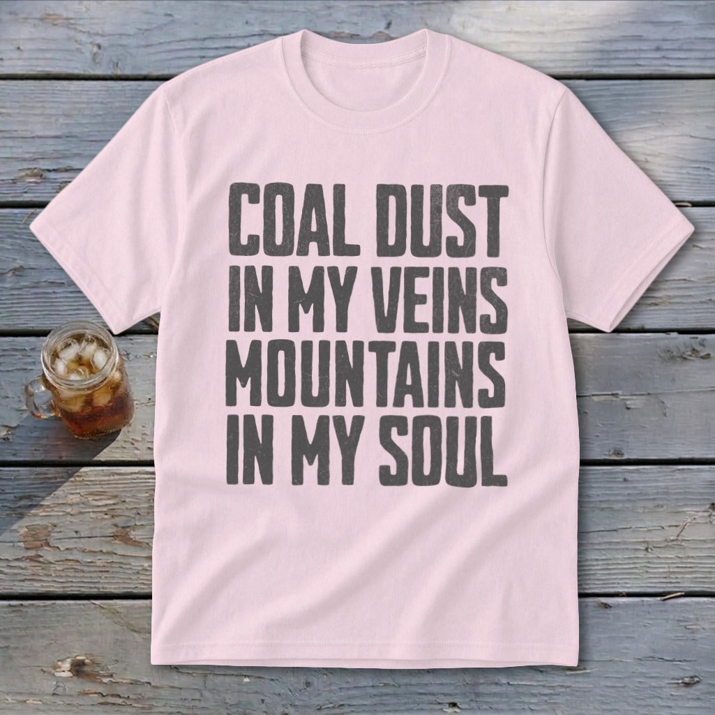 A light pink t-shirt printed with the text Coal Dust in My Veins Mountains in My Soul.