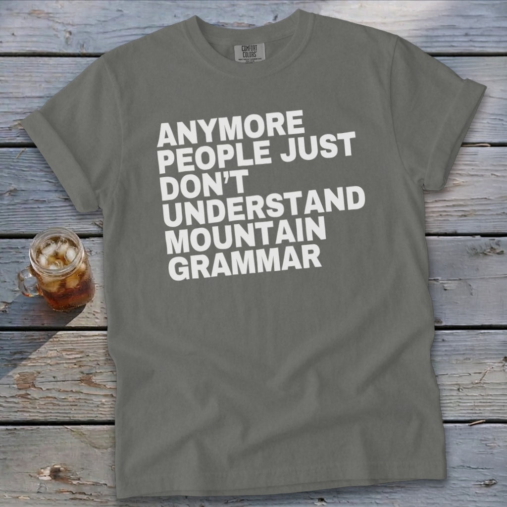 Grey t-shirt with white text that reads "Anymore people just don't understand mountain grammar."