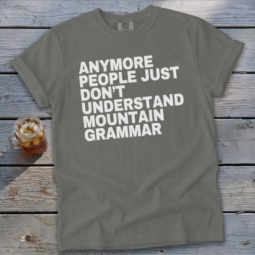 Grey t-shirt with white text that reads "Anymore people just don't understand mountain grammar."