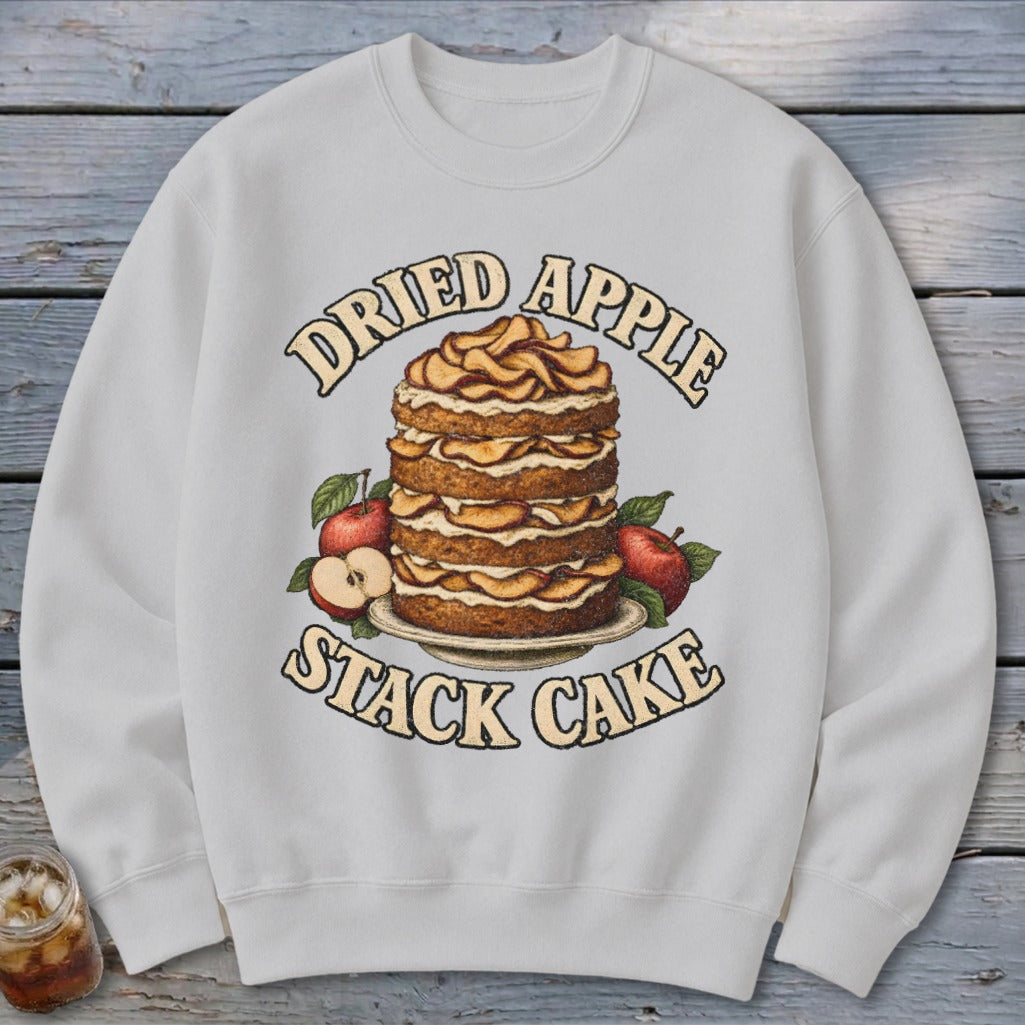 White sweatshirt with "Dried Apple Stack Cake" graphic of a stacked cake with apples.