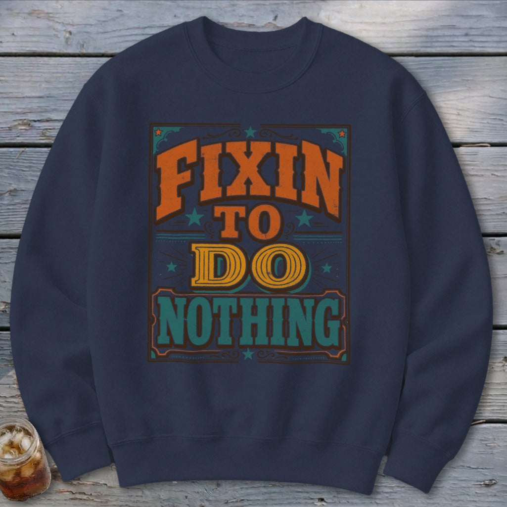 Navy sweatshirt with "Fixin' to Do Nothing" graphic text design.