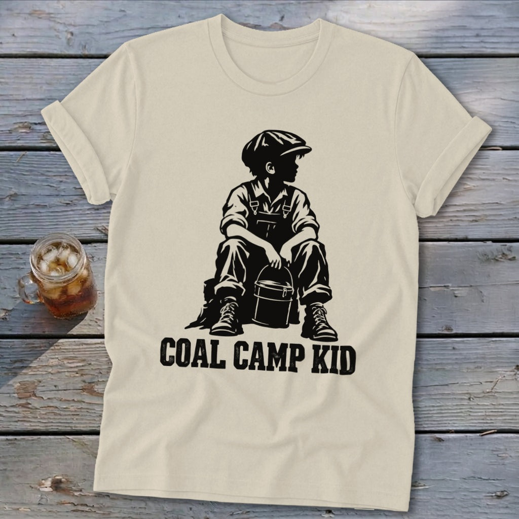 Cream t-shirt with "Coal Camp Kid" text and silhouette of a boy with a bucket.