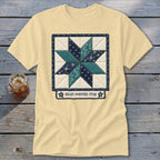 Pale yellow t-shirt with an eight-pointed star quilt block design.
