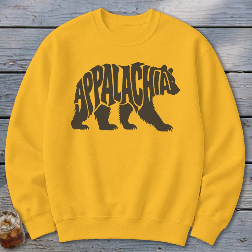 Gold crewneck sweatshirt featuring a brown bear graphic filled with the word Appalachia.