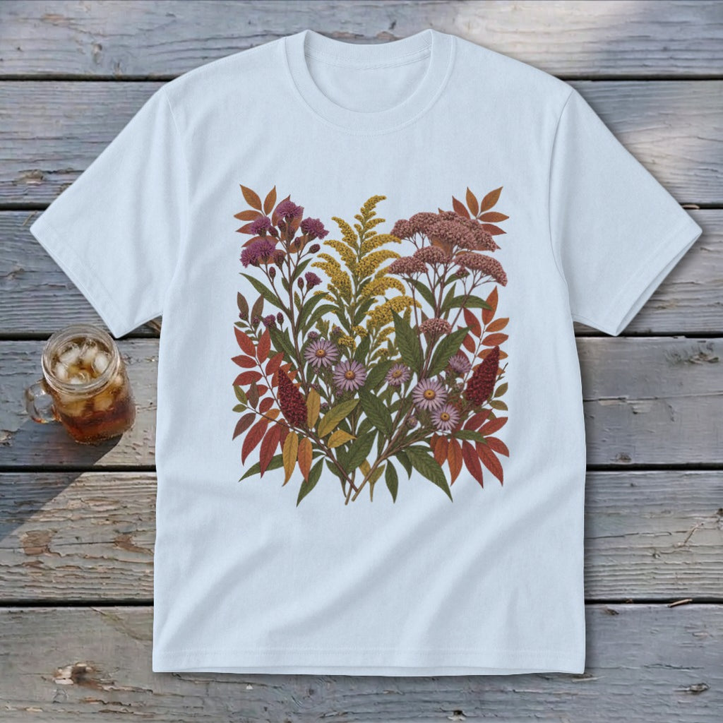 White t-shirt with a floral illustration of autumn wildflowers and leaves.