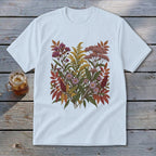 White t-shirt with a floral illustration of autumn wildflowers and leaves.