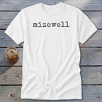 White t-shirt with "mizewell" printed in black, typewriter-style font.