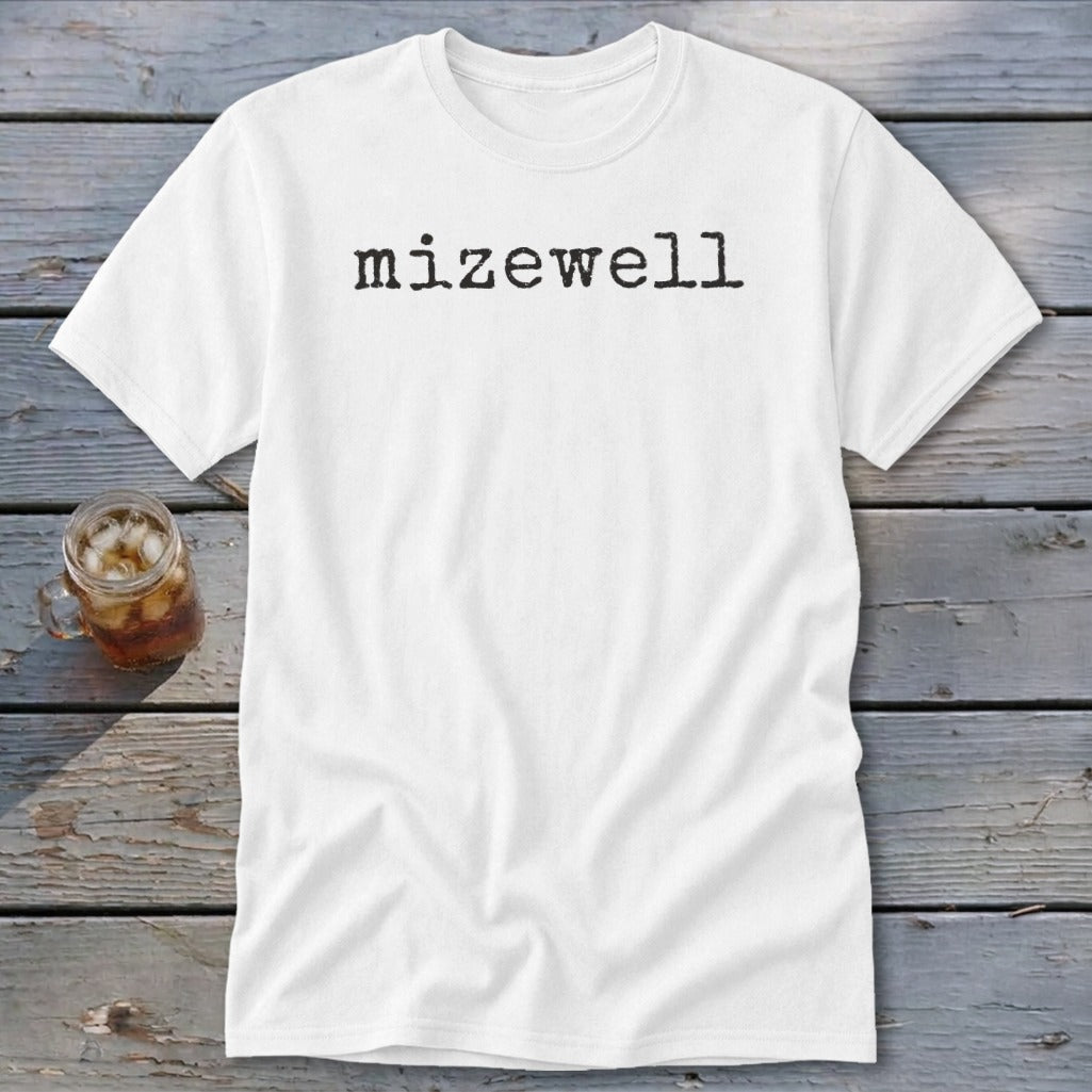 White t-shirt with "mizewell" printed in black, typewriter-style font.