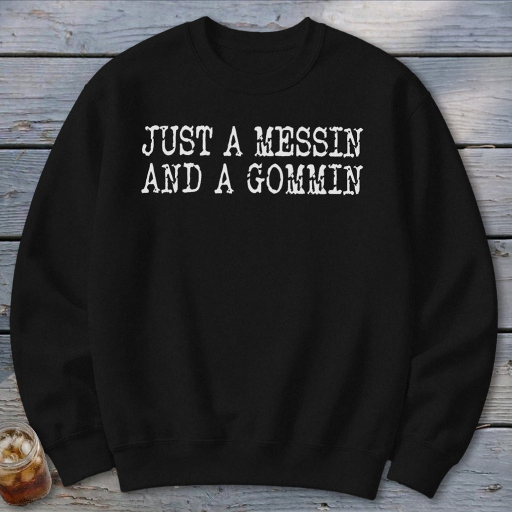 Black crewneck sweatshirt with white text "JUST A MESSIN AND A GOMMIN".
